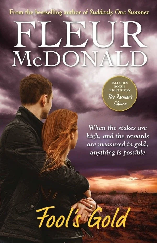 Book cover for Fool's Gold by Fleur McDonald. A couple hugging, look out over a paddock. The sky is stormy and moody.