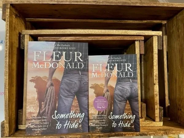 Two books next to each other one is smaller then the other but they have the same cover