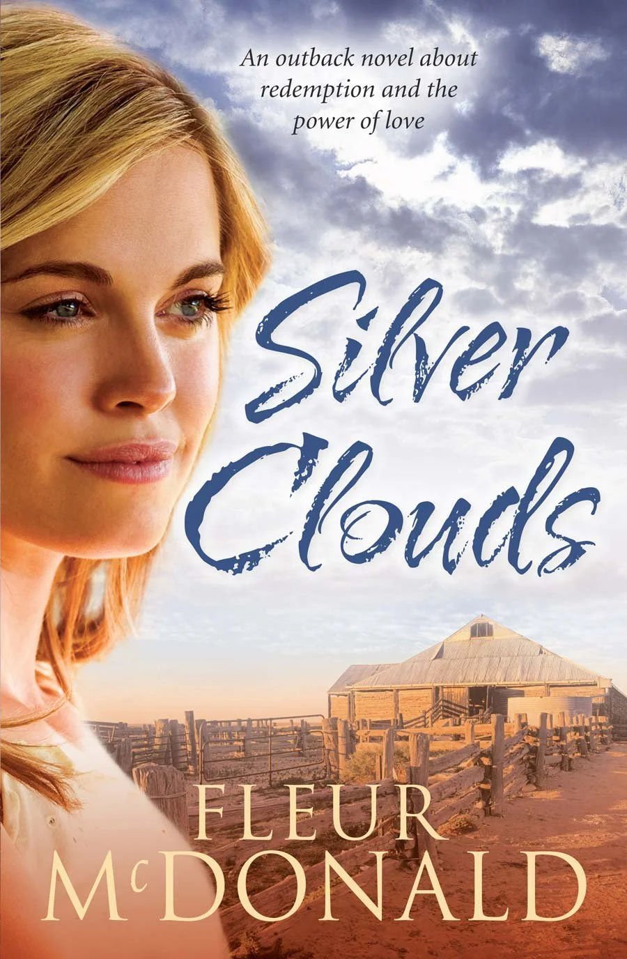 Book cover for 'Silver Clouds' by Fleur McDonald. Features a close-up of a woman's face with blonde hair, set against a rural landscape with a rustic wooden building, a fenced dirt road, and a partly cloudy sky.