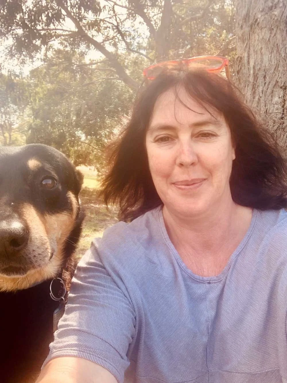 A photo of Jack, Fleur's dog, sitting next to her for a photo