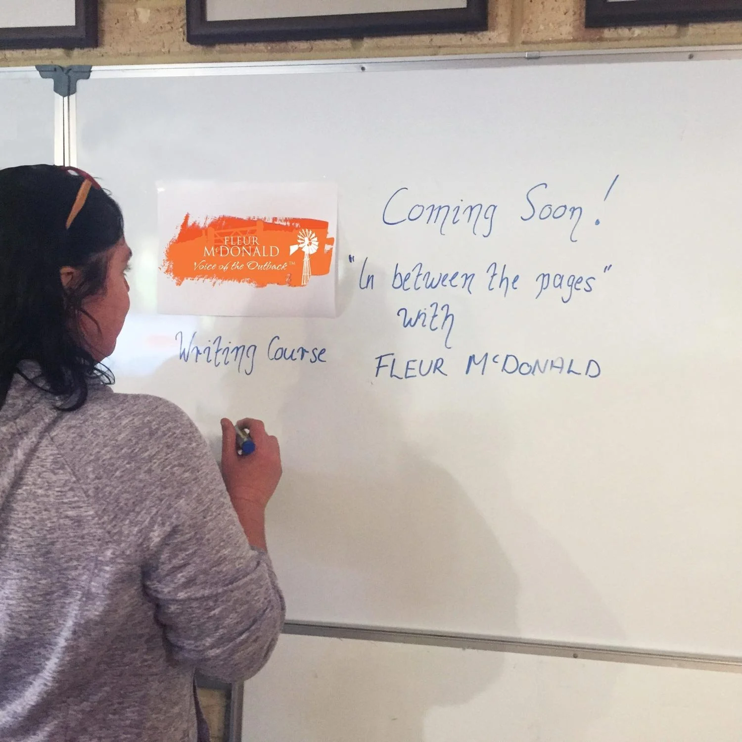 Fleur writes on white board: Coming Soon! In Between the Pages with Fleur McDonald Writing Course