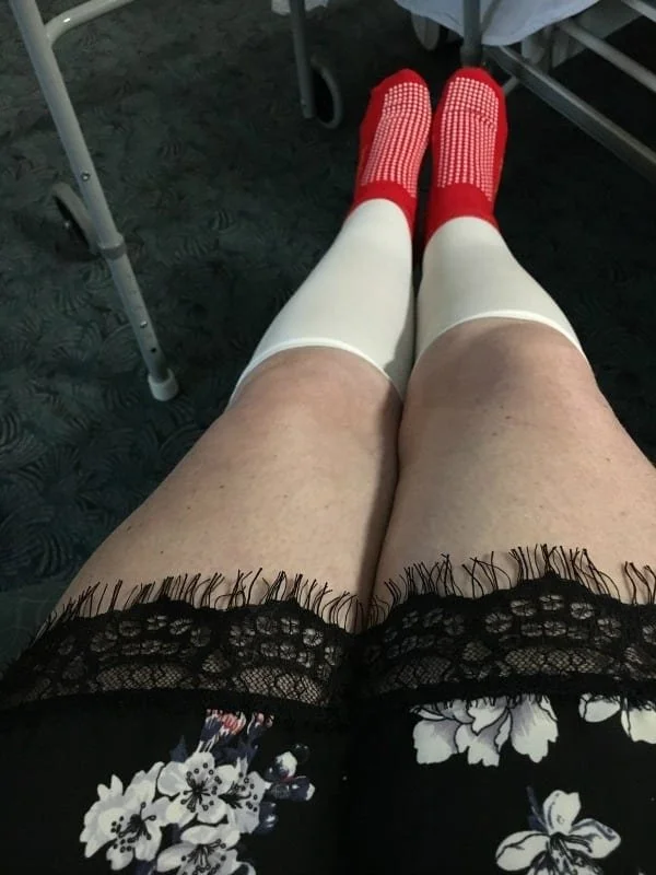 A shot looking down at Fleur's legs wearing compression socks