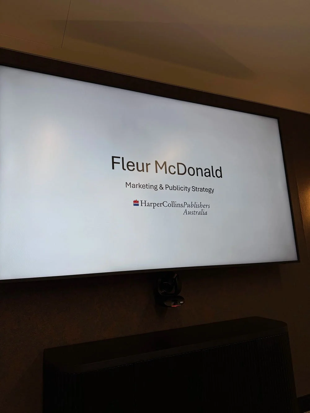 A large TV/Projection screen that reads: Fleur McDonald Marketing & Publicity Strategy - HarperCollins Publishers Australia