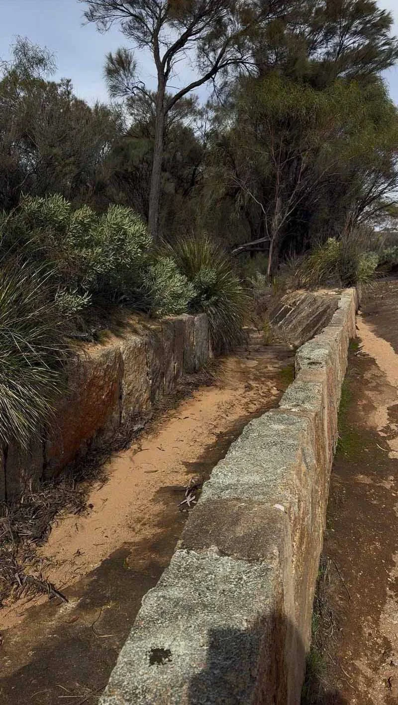 Two stone walls with a gap in between them