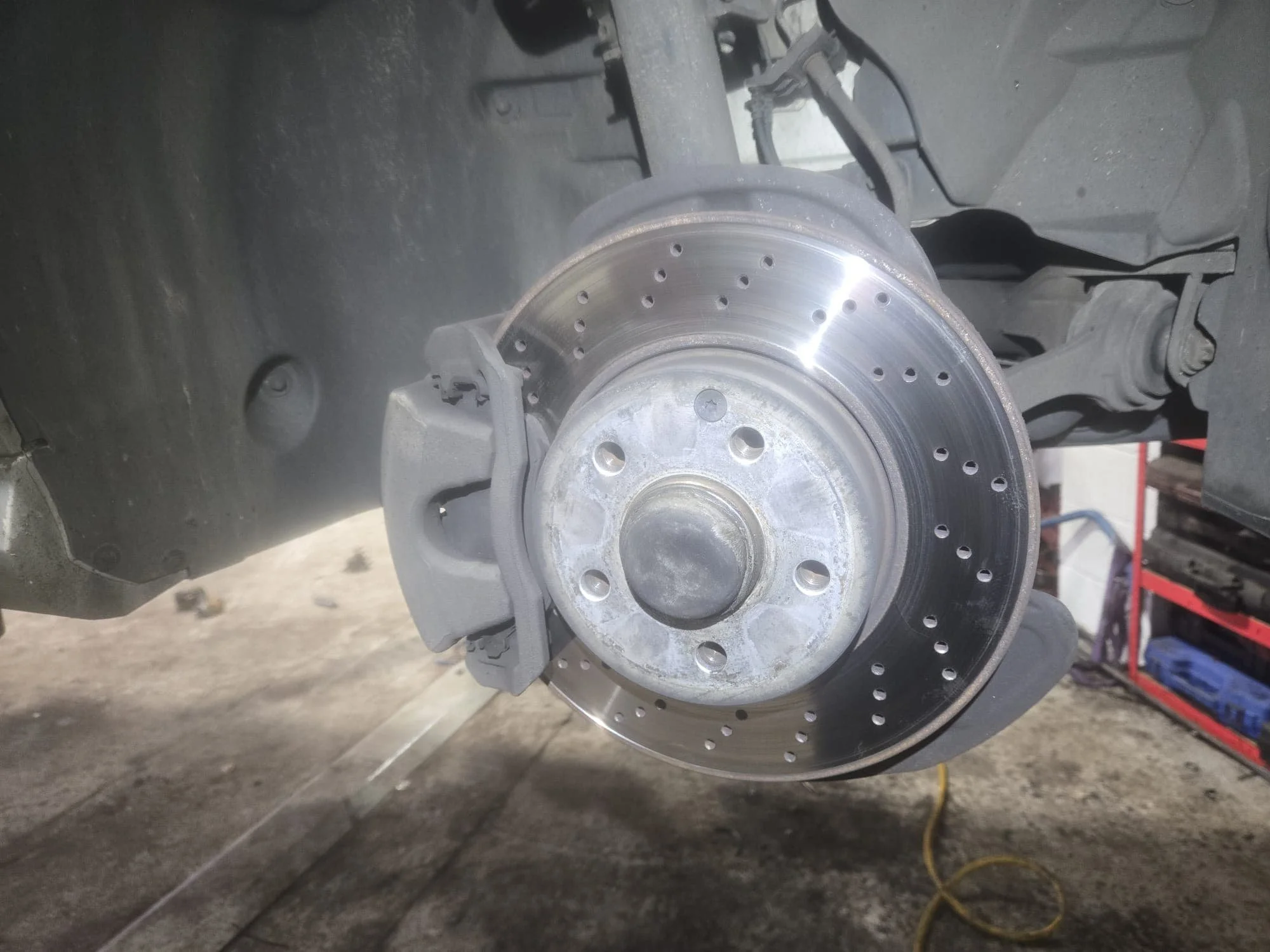 Inspecting brakes on a customers car