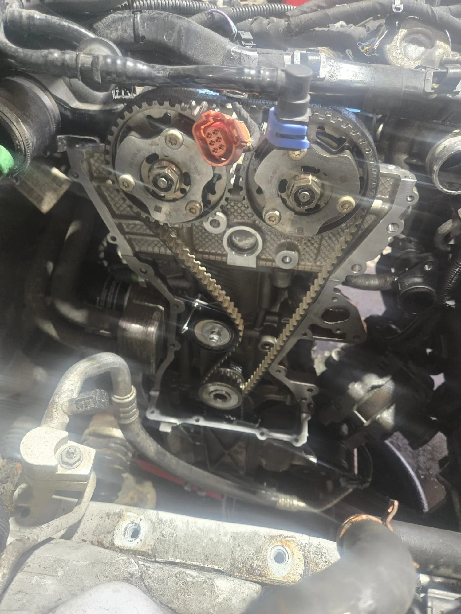 Audi A3 cambelt replacement in progress at Premier Tyres Spondon, showing the timing belt system exposed during maintenance.