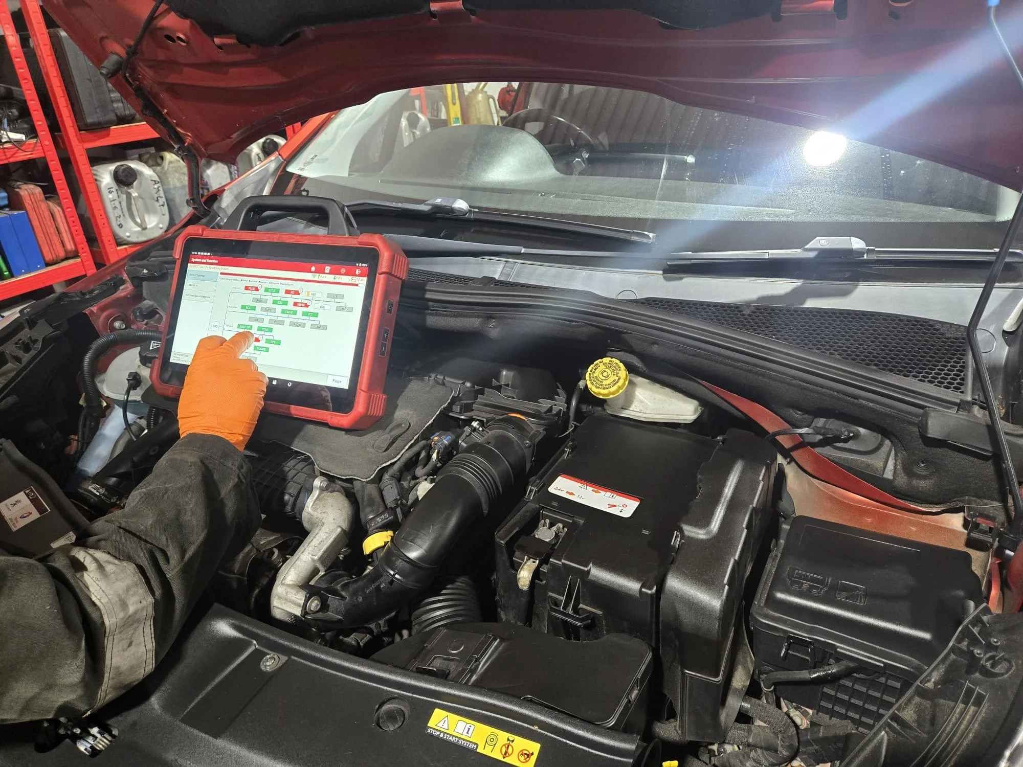 Premier tyres spondon technician diagnosing a vehicle