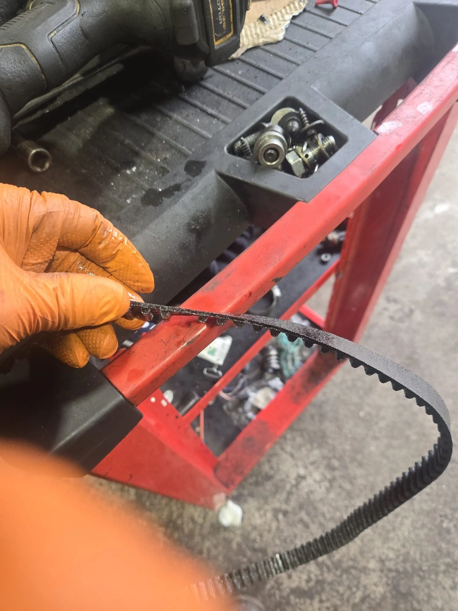 A physical wet belt that has been taken of a customers car