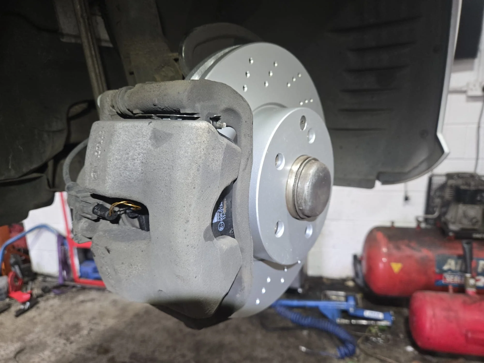 Brake discs and pads freshly fitted on customers car