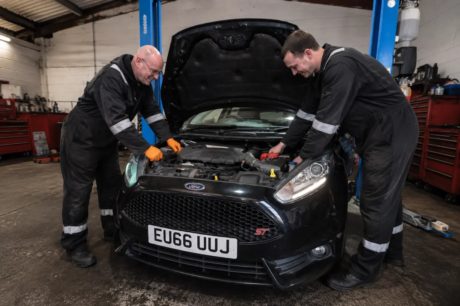 Premier Tyres Spondon mechanics working on a Ford Fiesta ST during vehicle repair at our garage in Spondon, Derby.