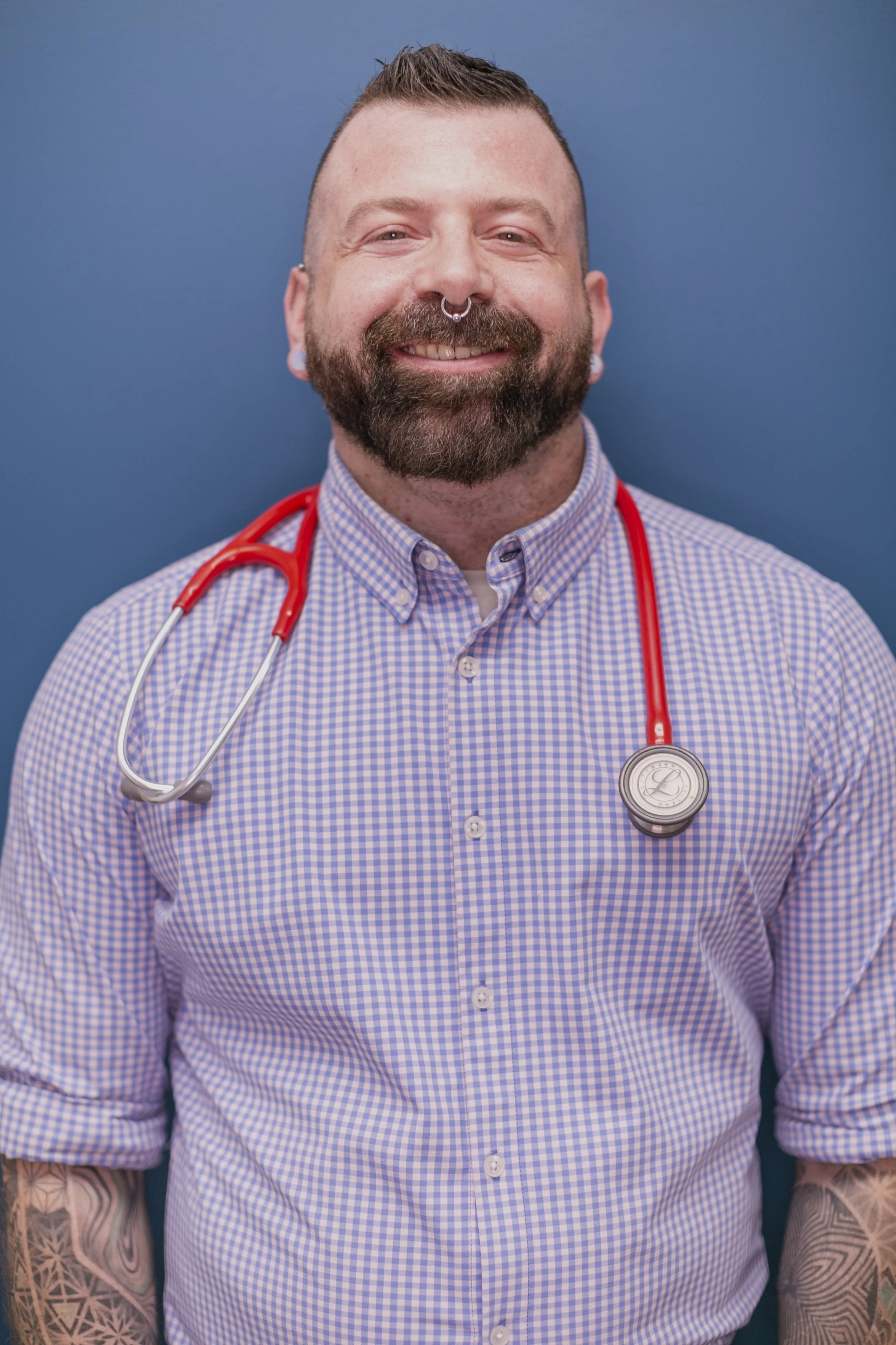 Primary care and mental health clinician wearing a stethoscope, representing accessible, patient-centered medical care for adults in Alaska and California.