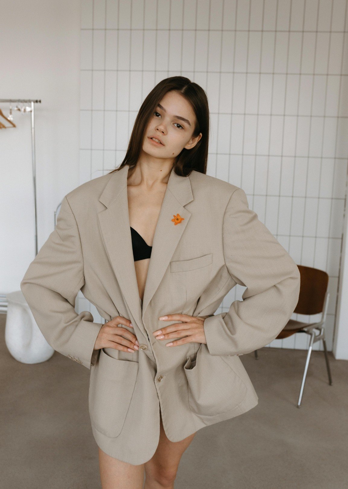 Fashion model wearing an oversized blazer, representing high-fashion content creation and influencer styling for luxury brand promotion