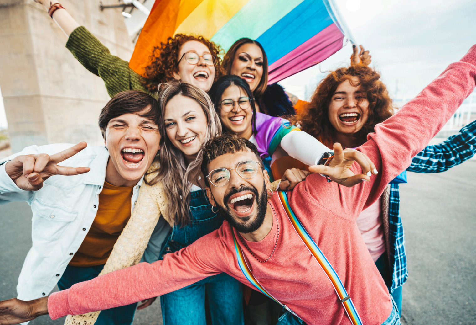 Diverse, excited group representing strong community building for community management. Link Influence fosters authentic engagement and conversion.