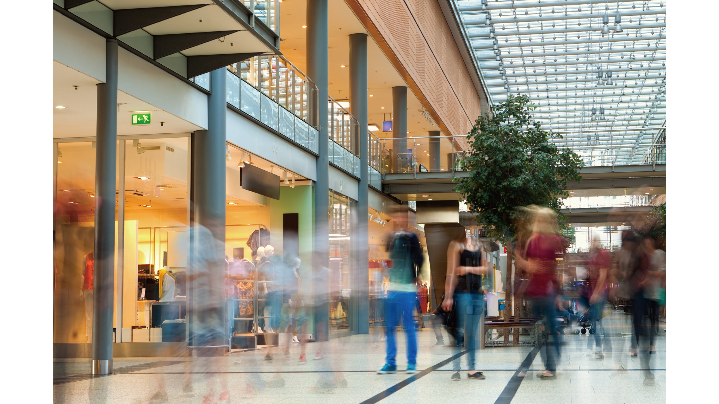 Busy shopping mall interior, illustrating Grand Opening Campaign impact. Link Influence bridges digital to in-store experience and drives foot traffic with creator content.