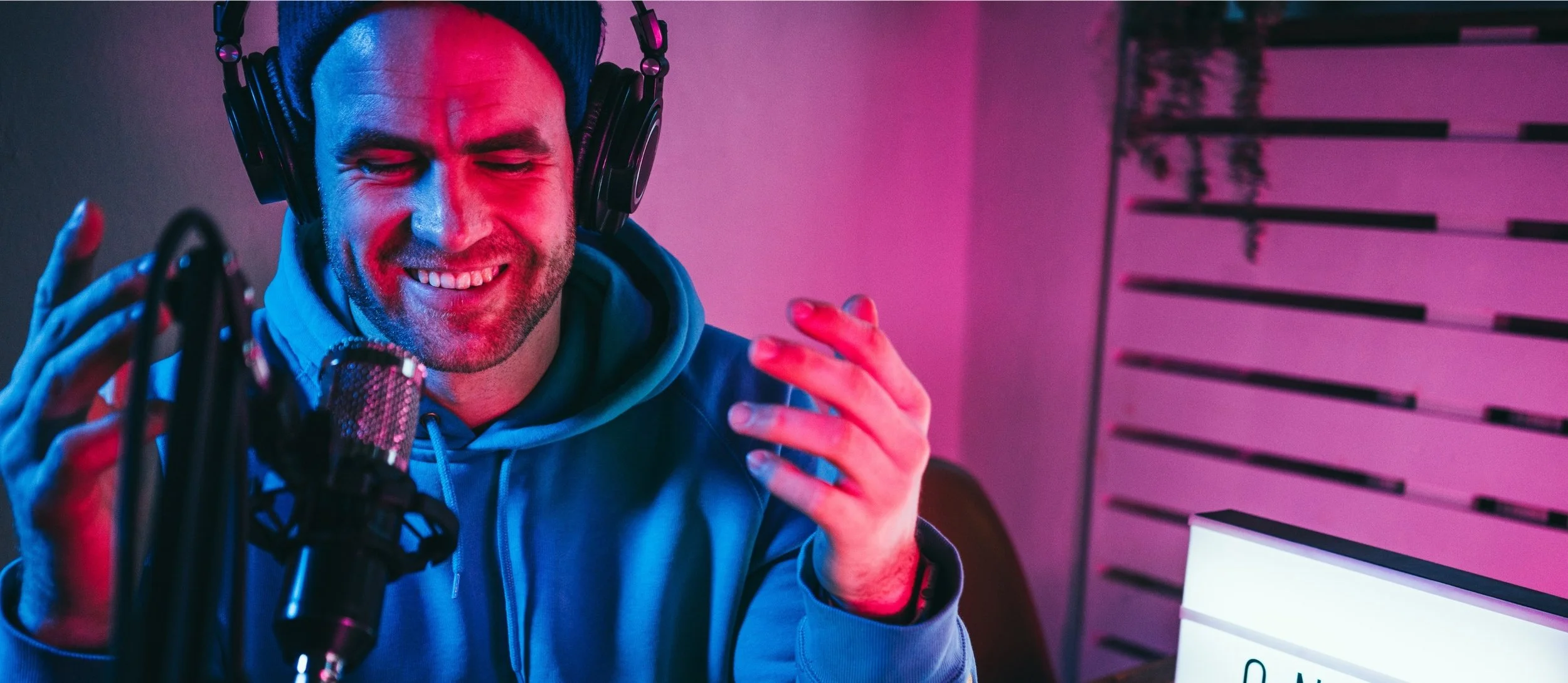 A creator at a microphone illustrating YouTube intent-based marketing strategies using Google data.