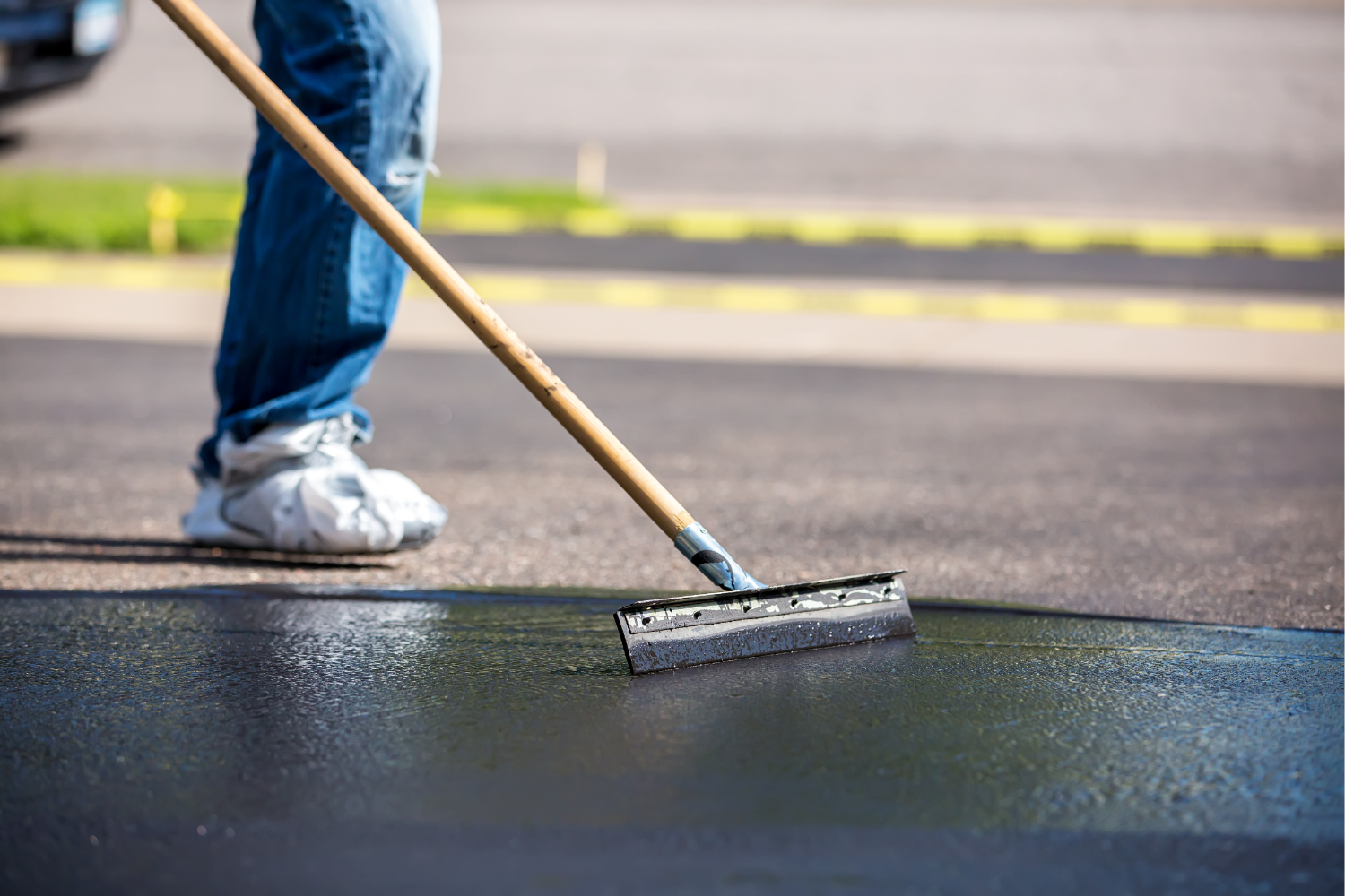 How Sealcoating Protects Your Asphalt from Michigan’s Harsh Winters