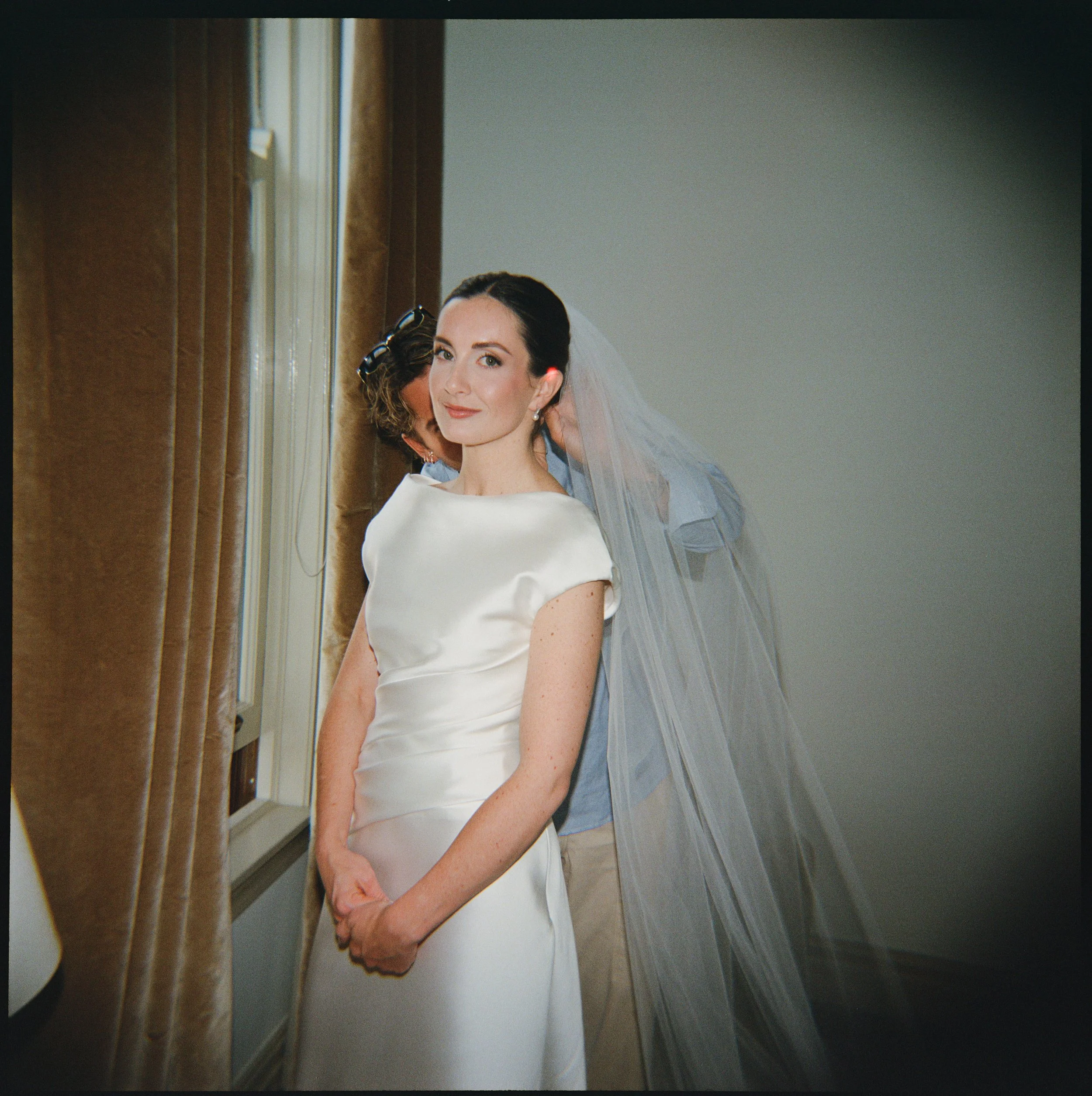 Film photo of a bride on her wedding day at Cafe Brauer