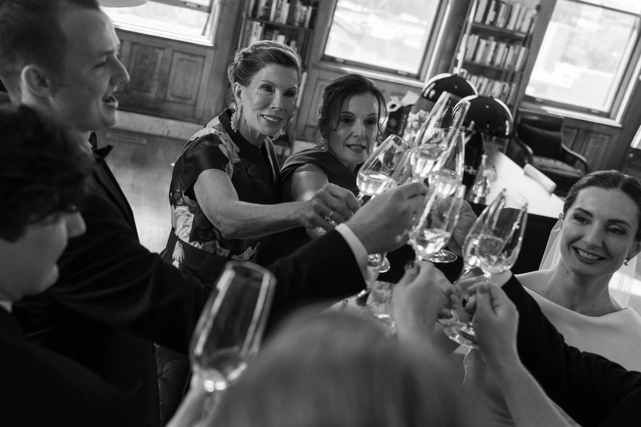 Guests toasting at a Chicago Cafe Brauer wedding in Lincoln Park