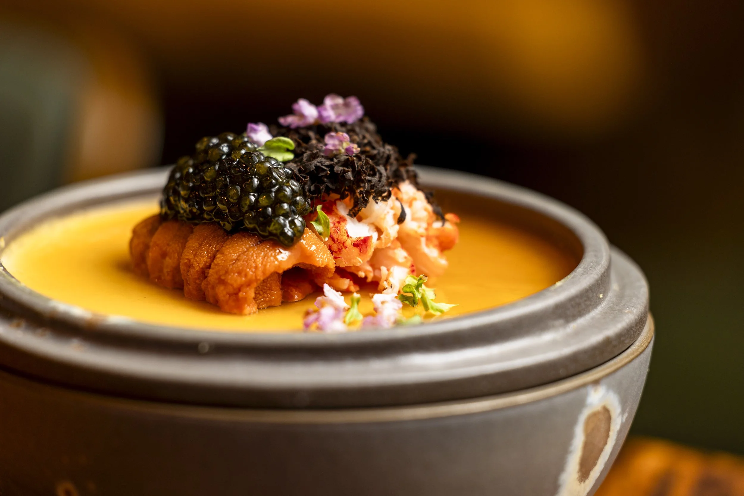 Omakase course featuring orange roe, kaluga caviar and edible flowers, MINŌ Omakase Boca Raton