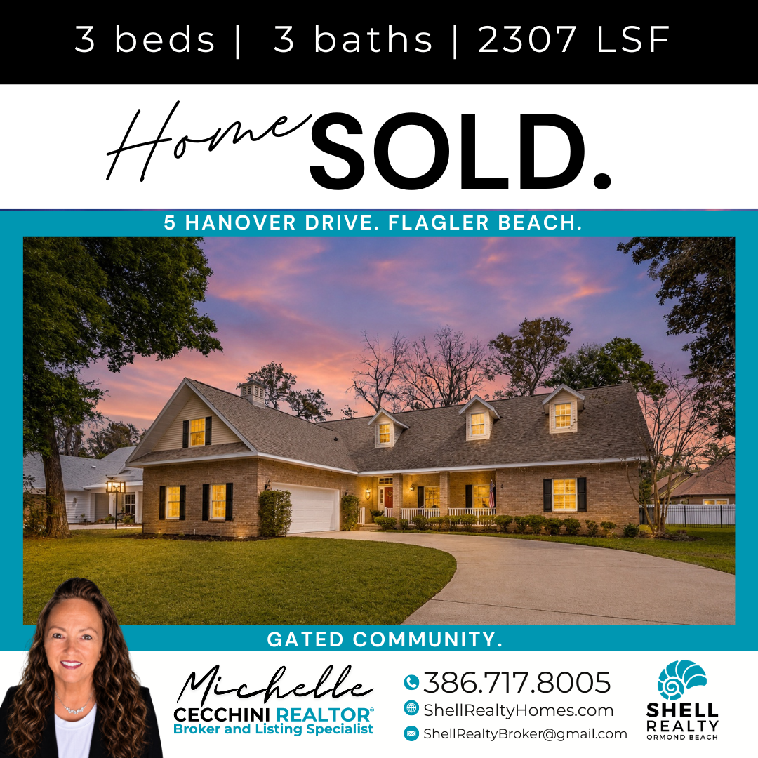 Real estate listing sign indicating home sold at 5 Hanover Drive, Flagler Beach, with picture of a house at dusk, contact info for broker Michelle Cecchini, a woman with long curly hair, and Shell Realty logo.