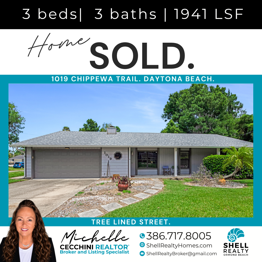 A house with a gray exterior, a two-car garage, and a front yard with a lawn and stone pathway. The image is part of a real estate listing that indicates the house has 3 bedrooms and 3 bathrooms, was built in 1941, and is located at 1019 Chippewa Tra