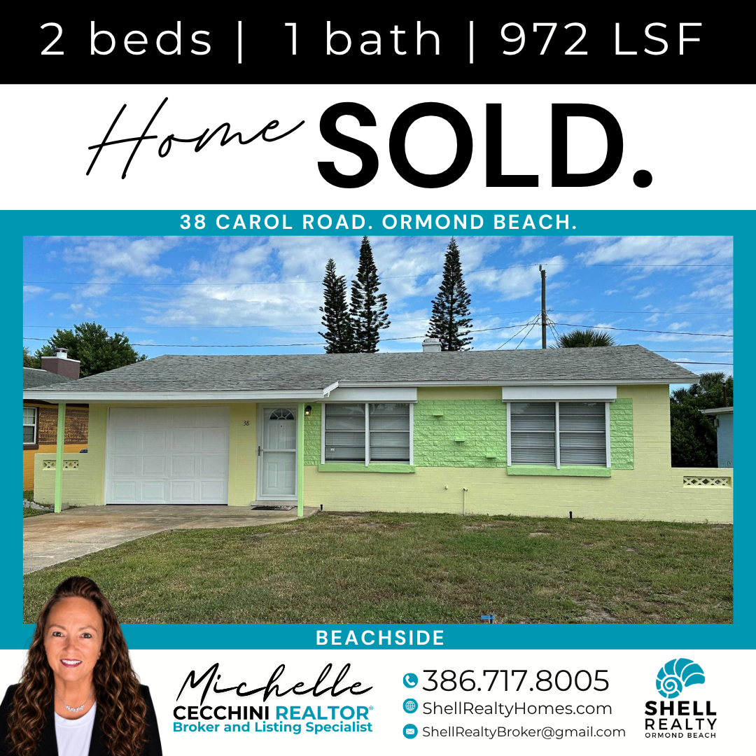 Real estate sign for a house sold in Ormond Beach, Florida. The house has a light yellow exterior with a gray roof, green shutters, and a white garage door. A photo of a woman, Michelle Cecchini, a real estate broker, is at the bottom left of the sig