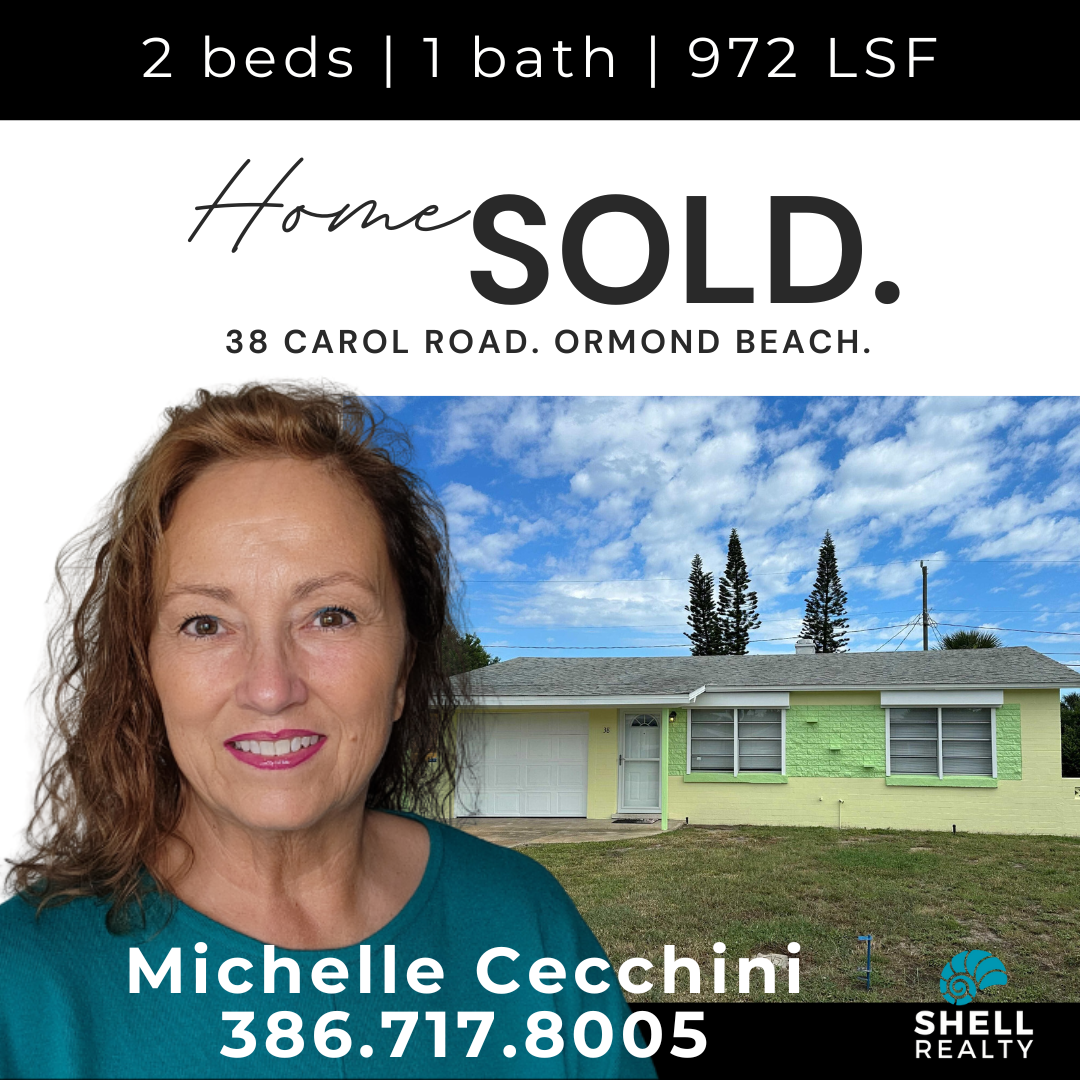 Real estate sign with a photo of Michelle Cecchini in front of a house, indicating the property has been sold. The sign provides the property details: 2 beds, 1 bath, 972 square feet, at 38 Carol Road, Ormond Beach. The sign includes Michelle Cecchin