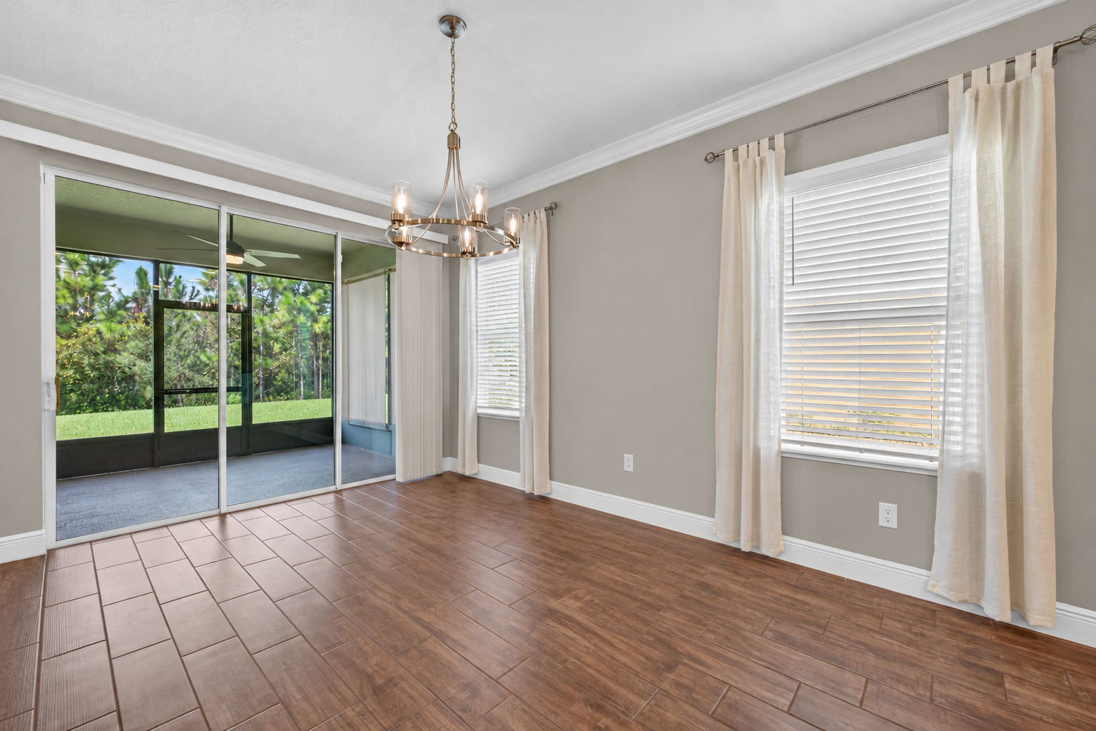 Virtually unstaged dining room and lanai 