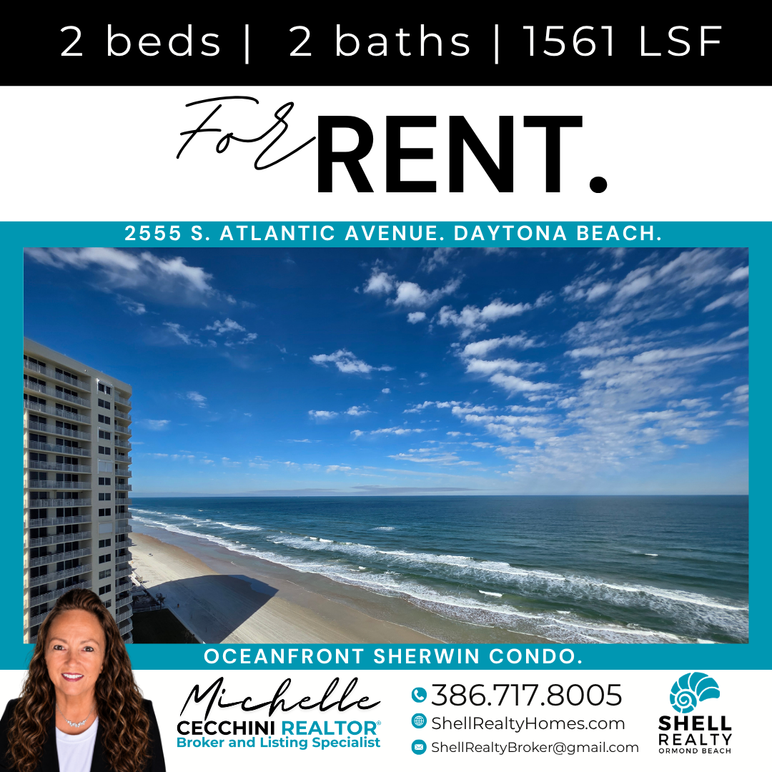 View of a beachfront condo overlooking the ocean with a sandy beach and a partly cloudy sky.
