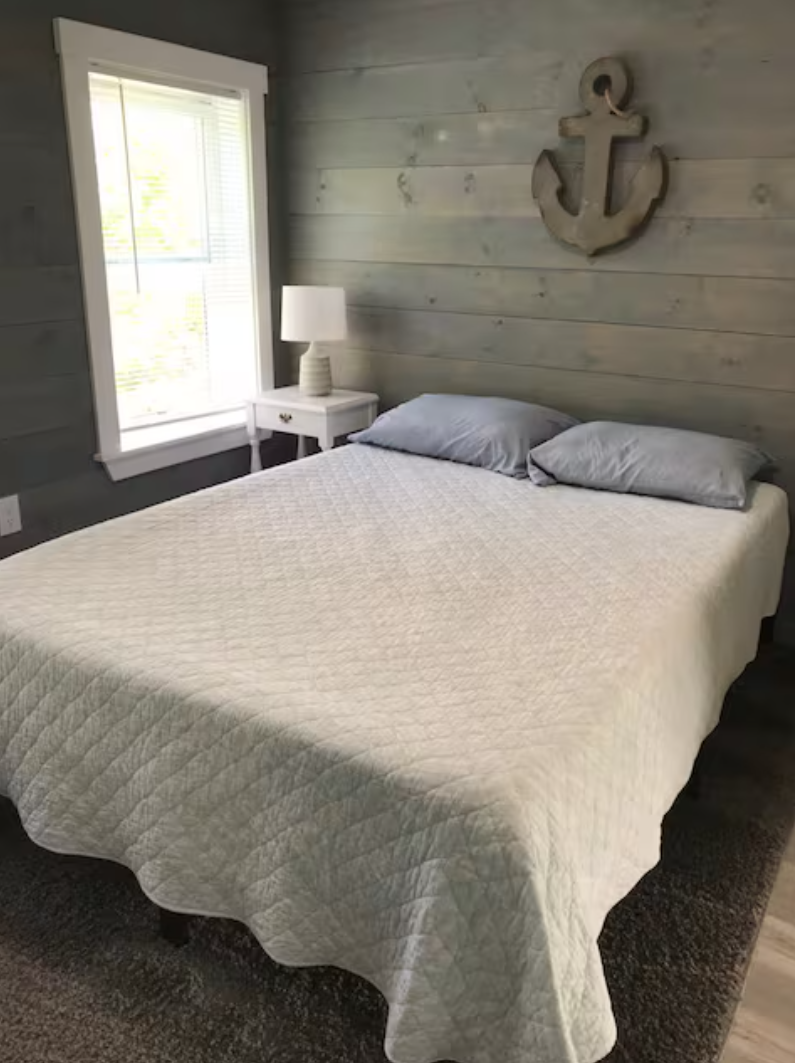Bedroom interior in elevated waterfront guest house in Maine