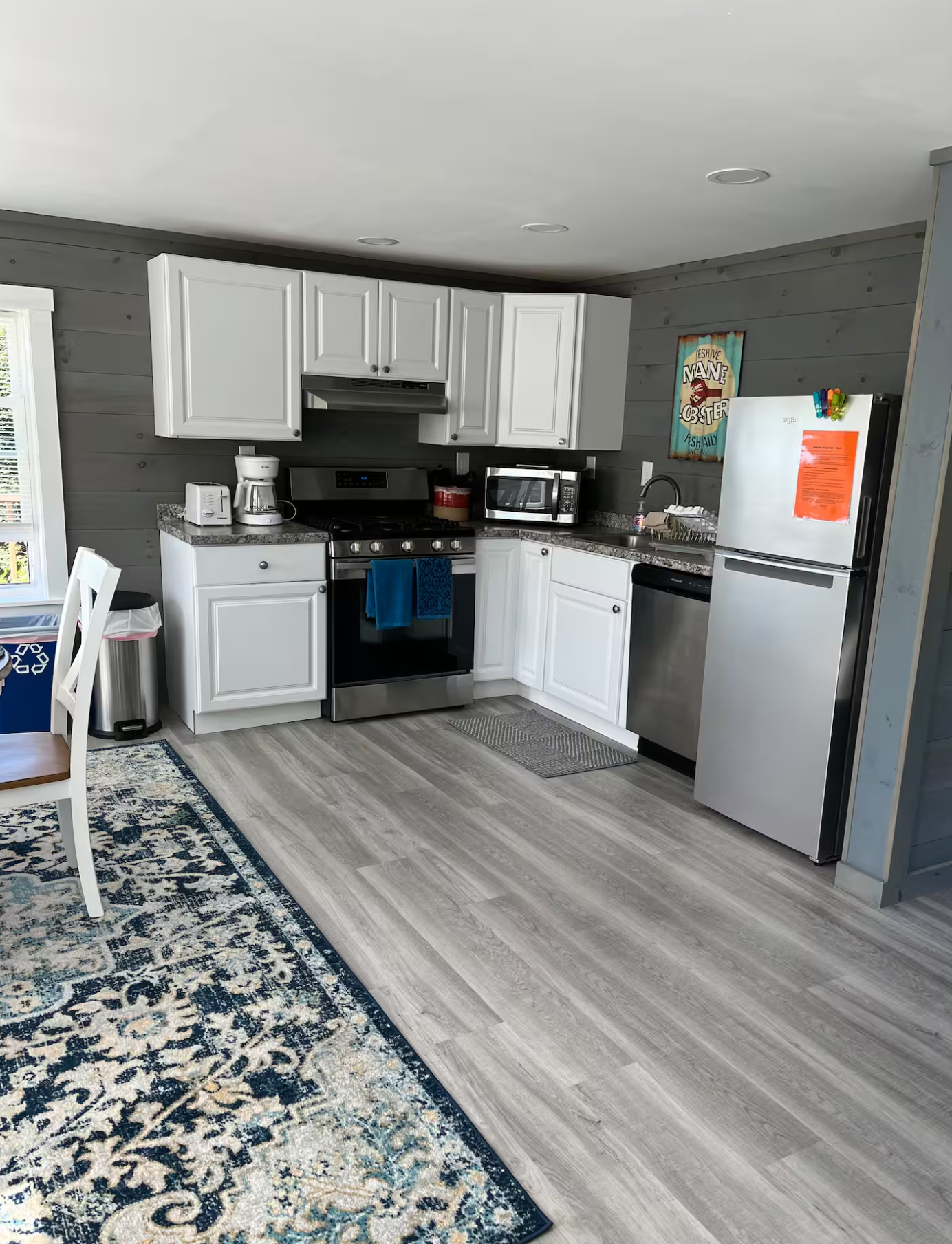 Kitchen area inside modern waterfront suite near Acadia