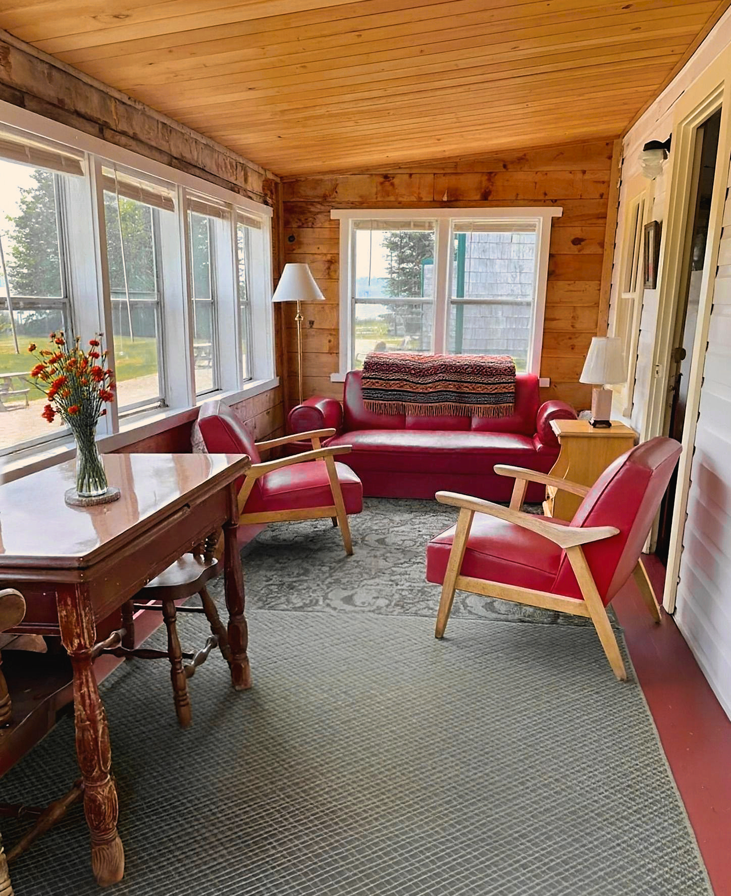 Living area inside rustic waterfront cabin near Acadia National Park