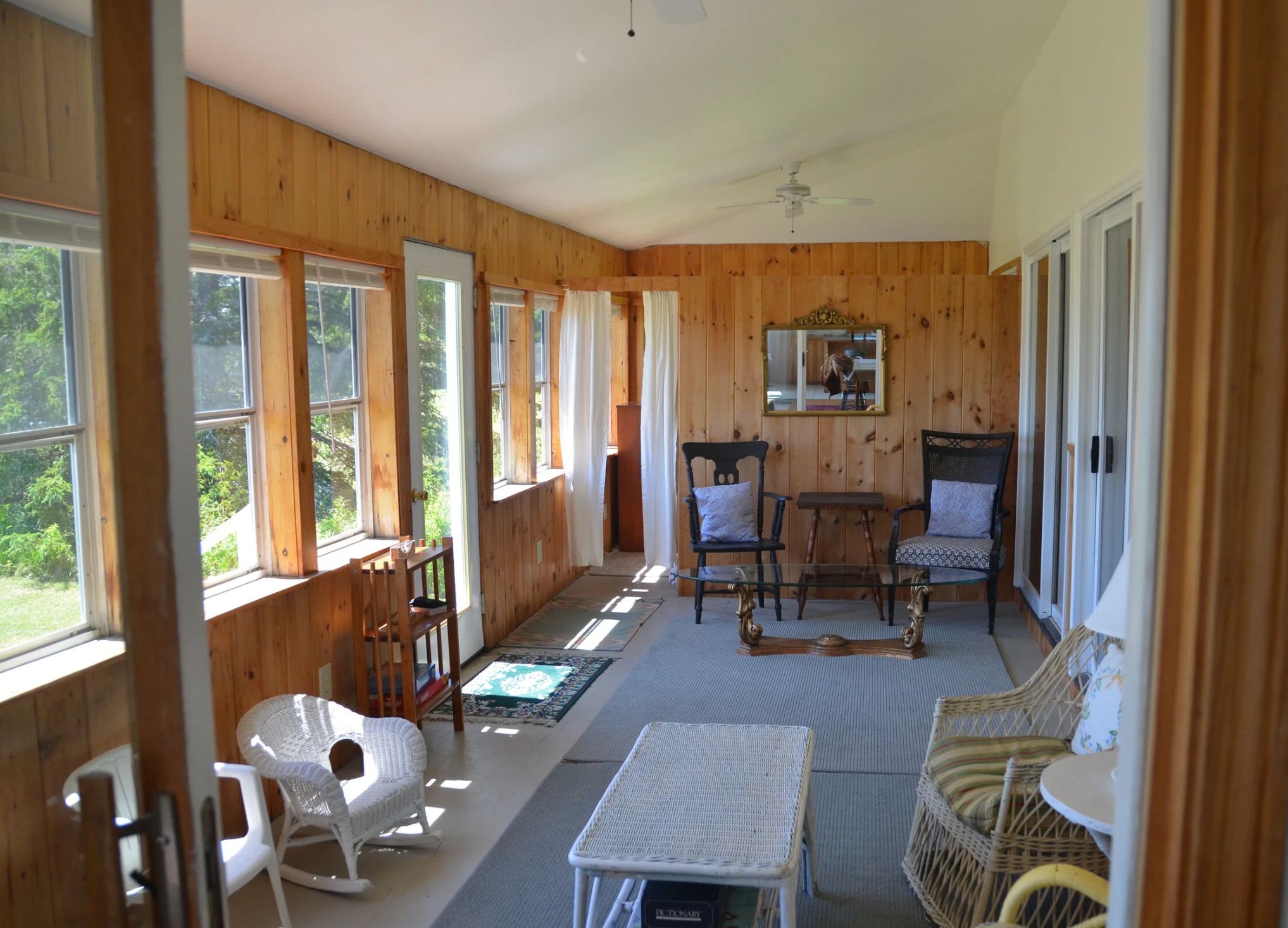 Sun porch inside waterfront home overlooking Flanders Bay