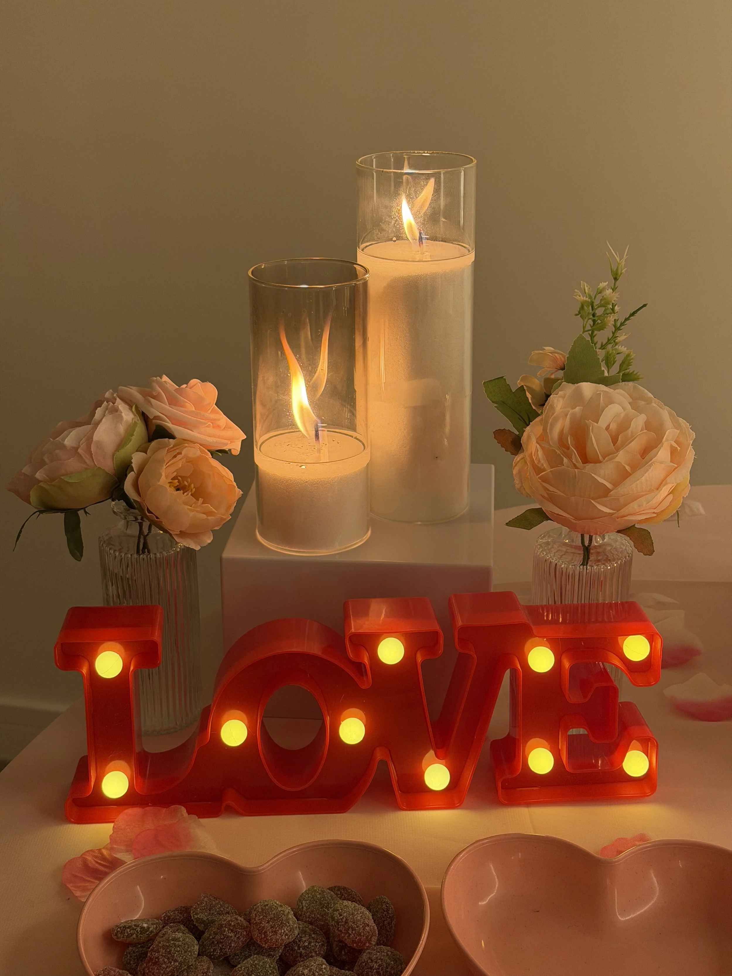 love sign with candles and flowers