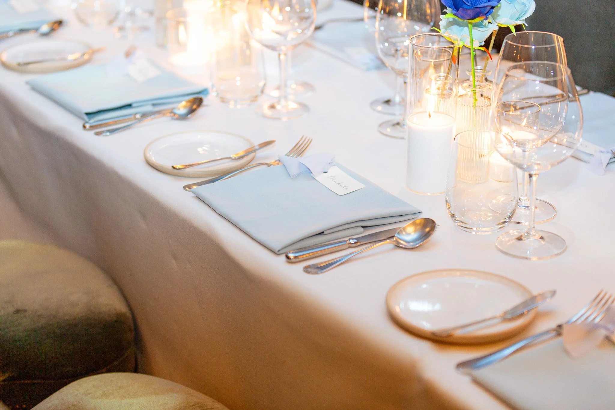 table setup with cutlery and napkin and decor