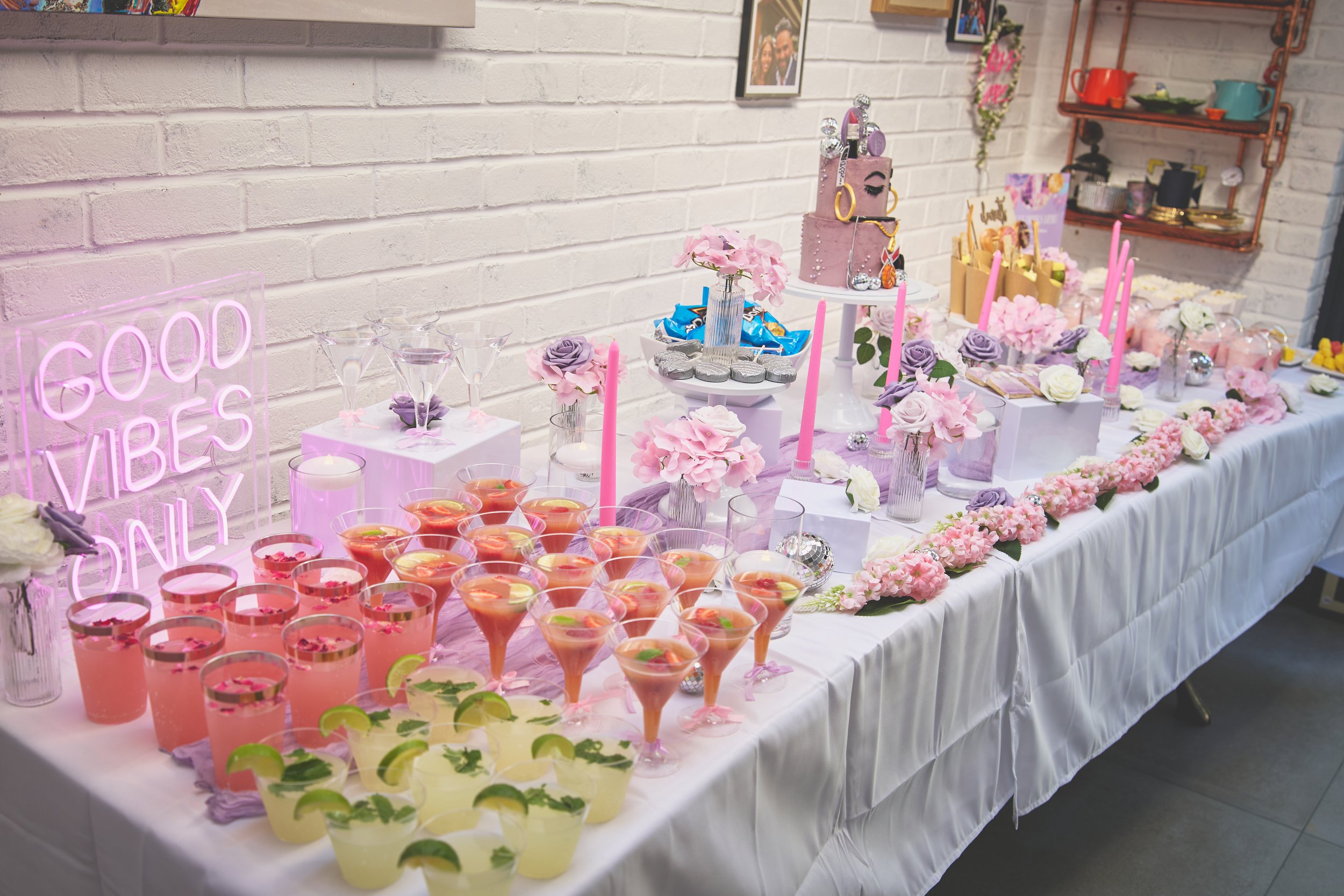 full complete setup with mocktails, neon signs, flowers