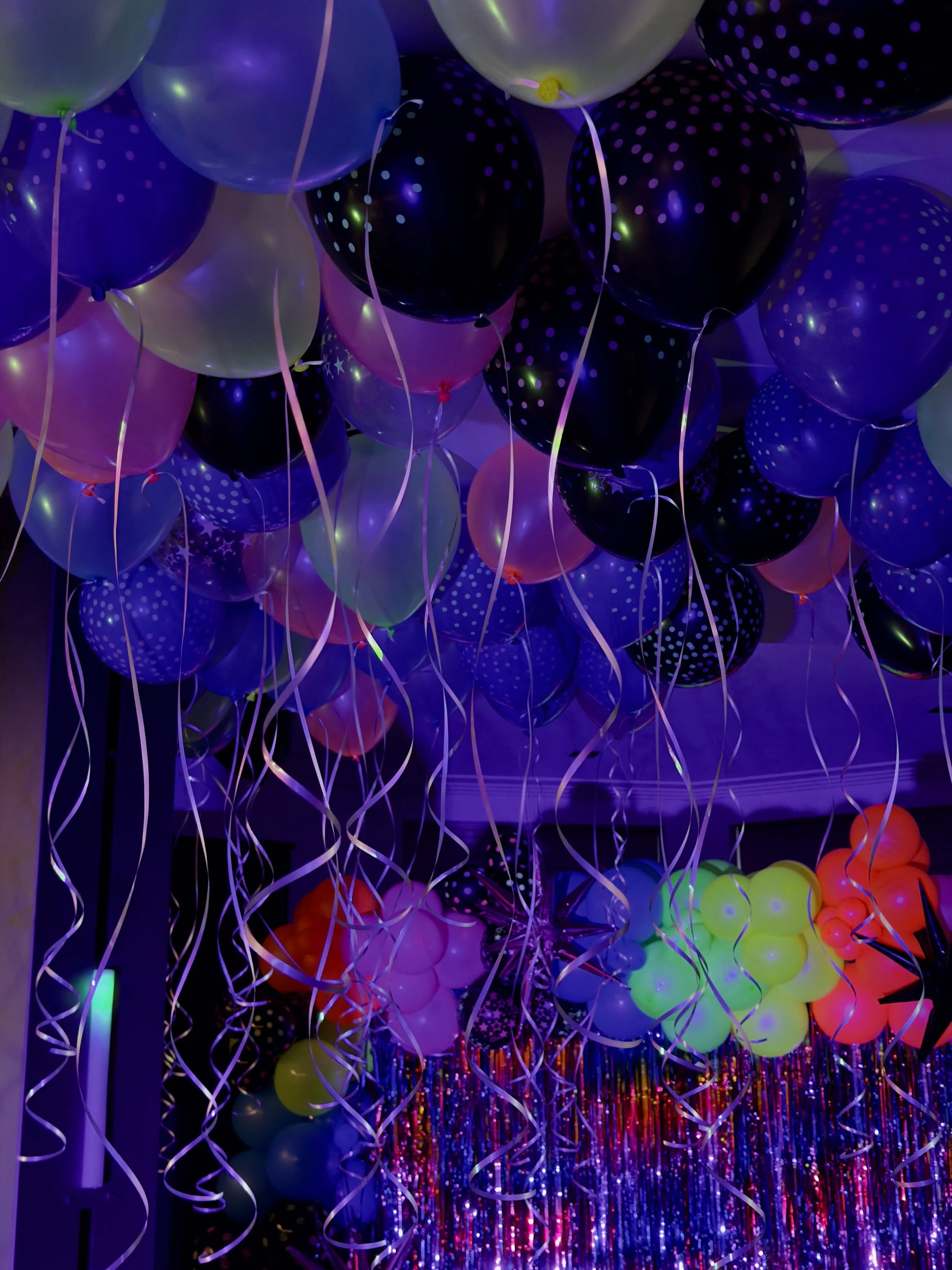 ceiling of glow in the dark balloons