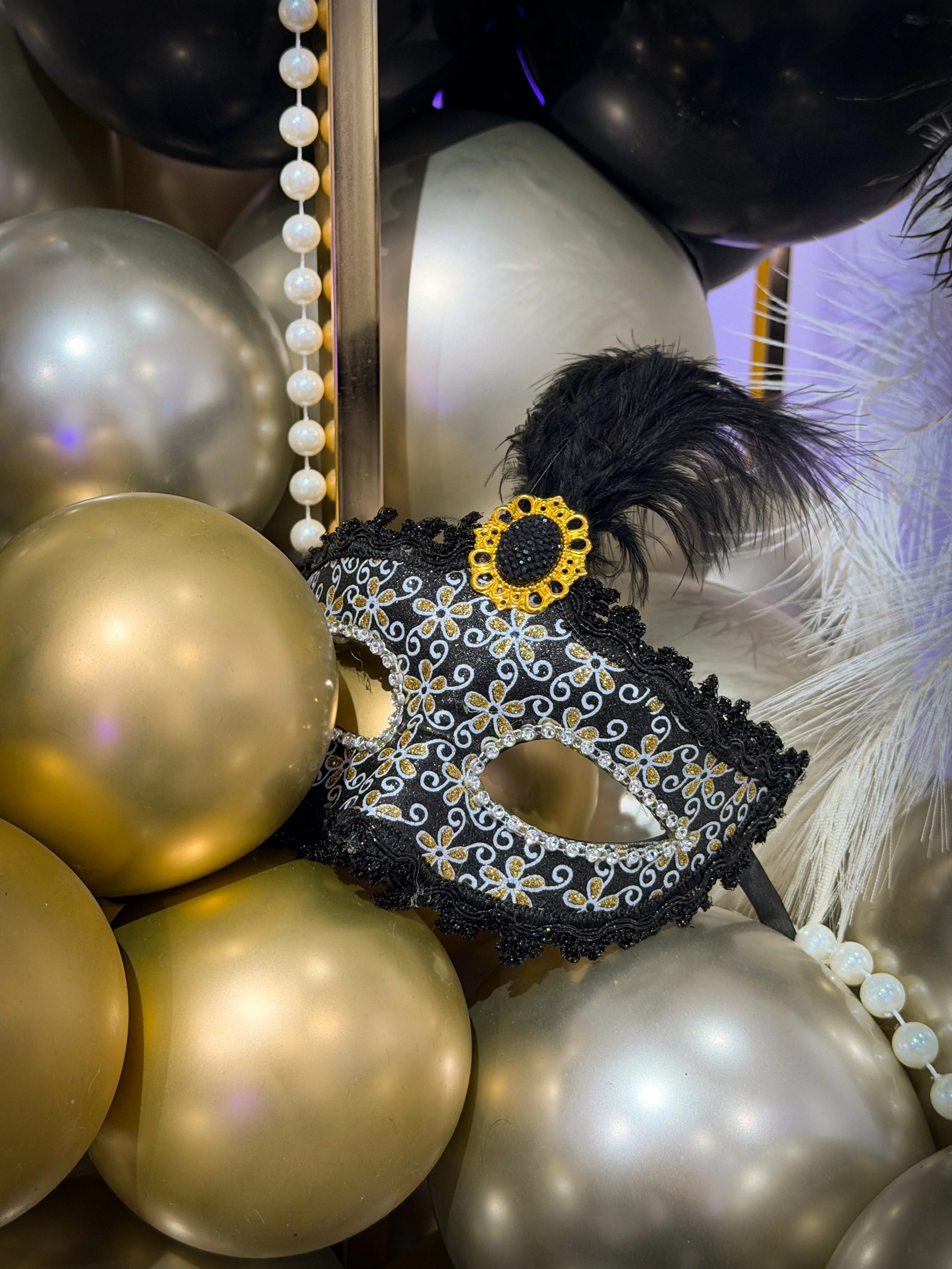 balloons, pearls and mask