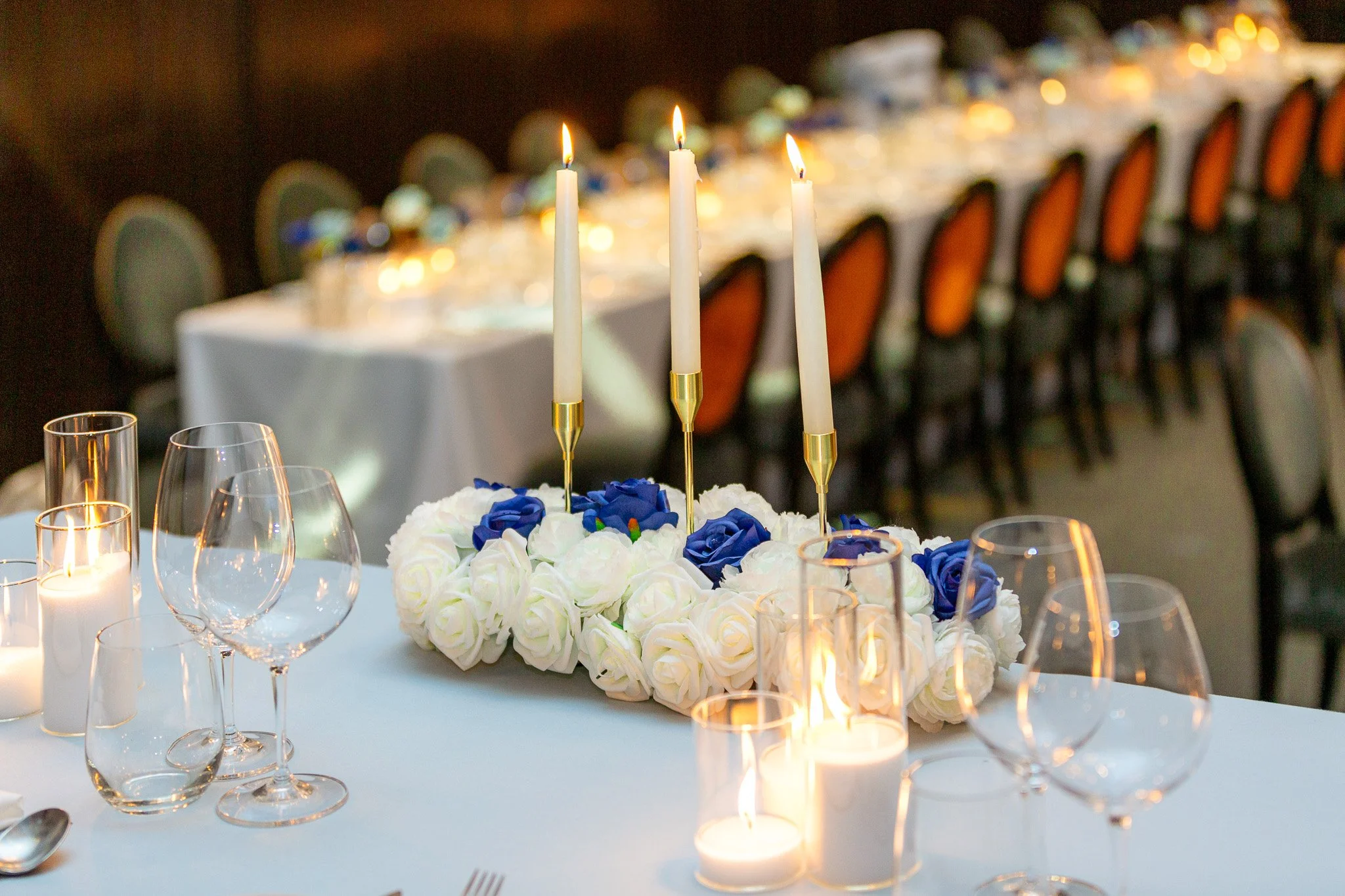 blue and white floral runner with candles