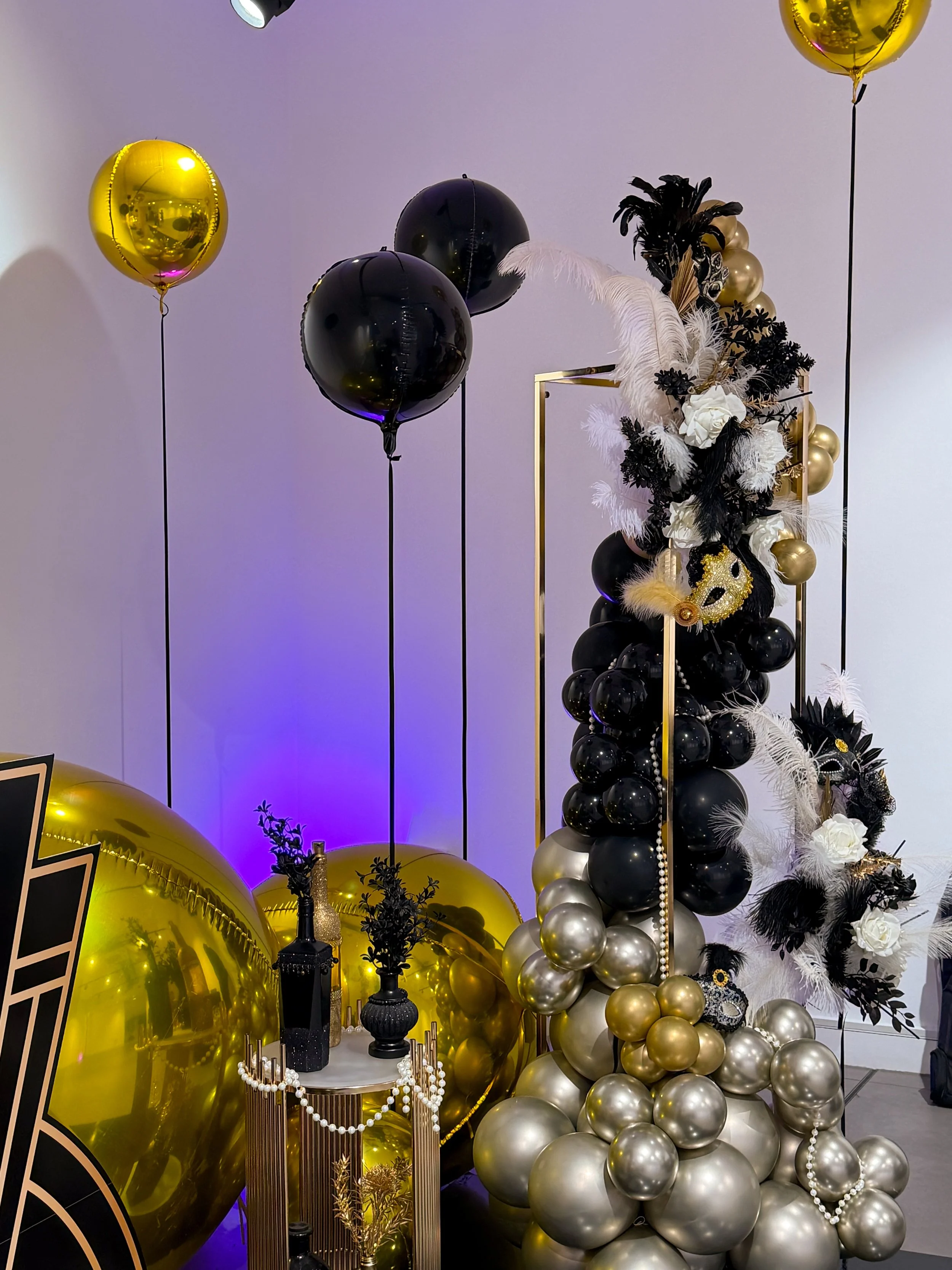 gold and black floating balloons
