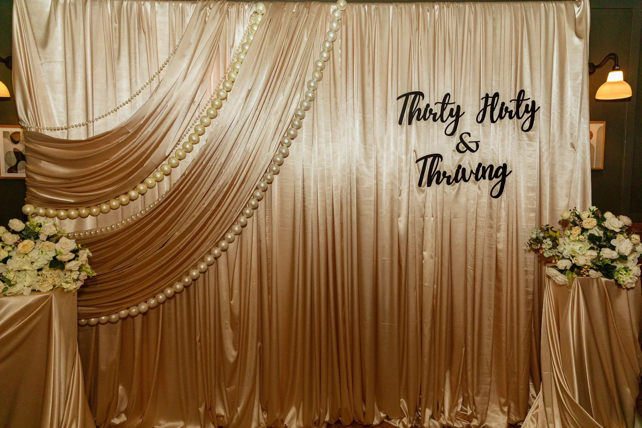 draped backdrop with pearls