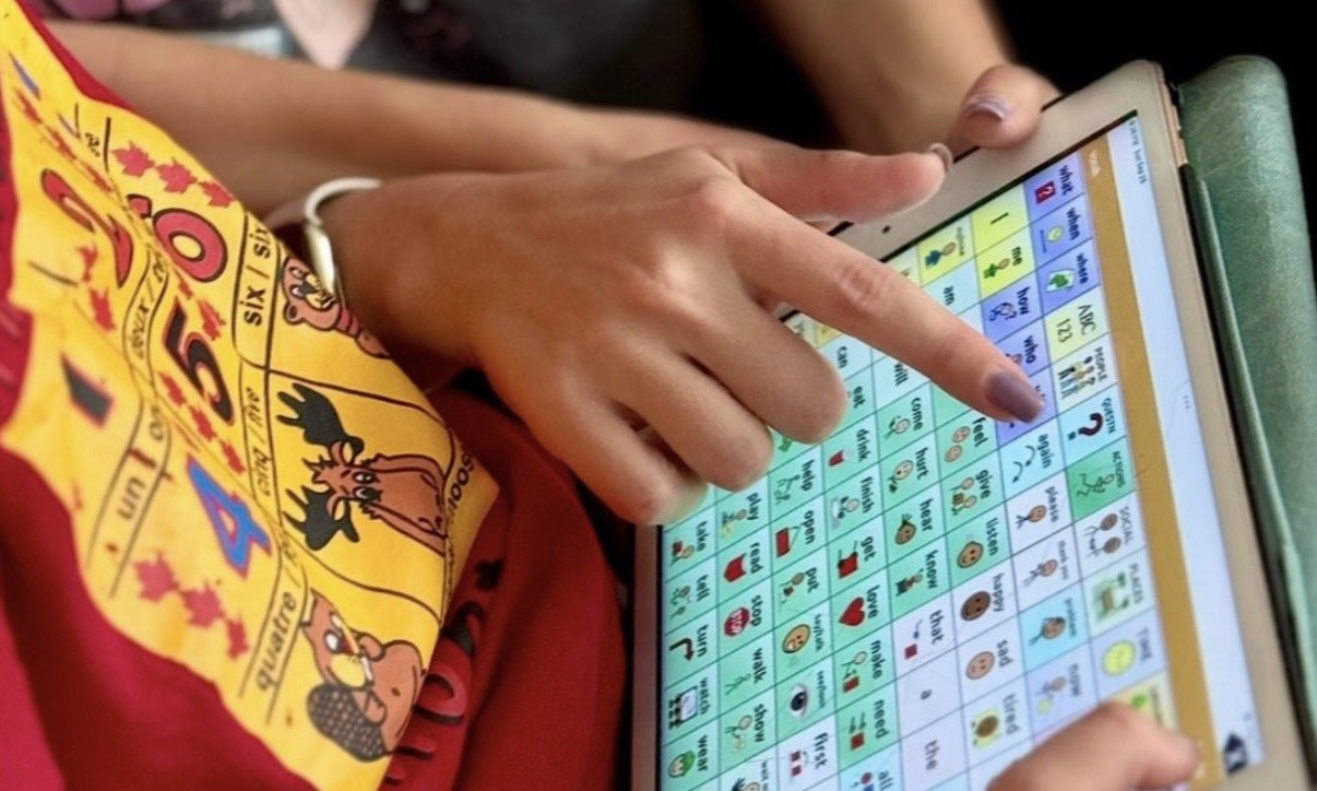 AAC communication support with a child and caregiver using a speech-generating device during pediatric speech therapy