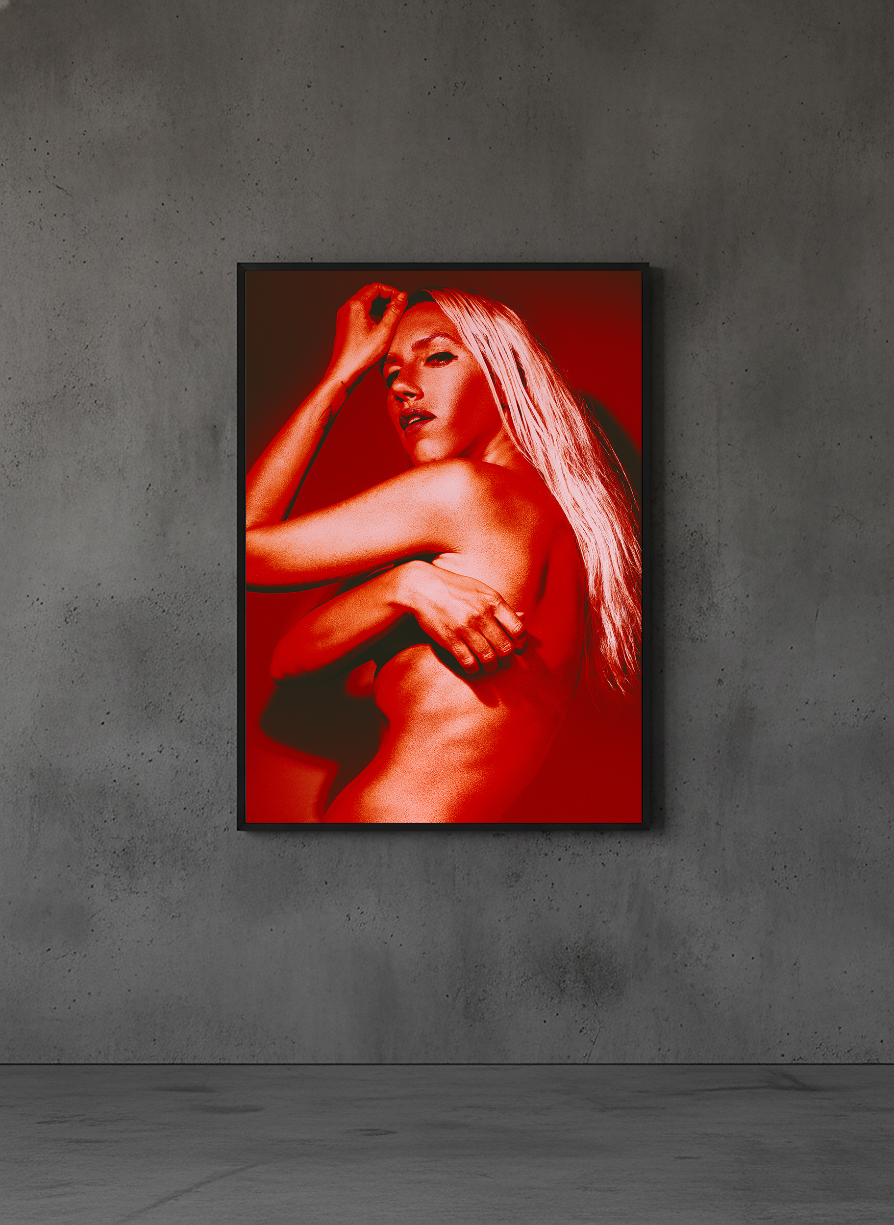 Experimental fine art portrait of female figure in red light, studio setting