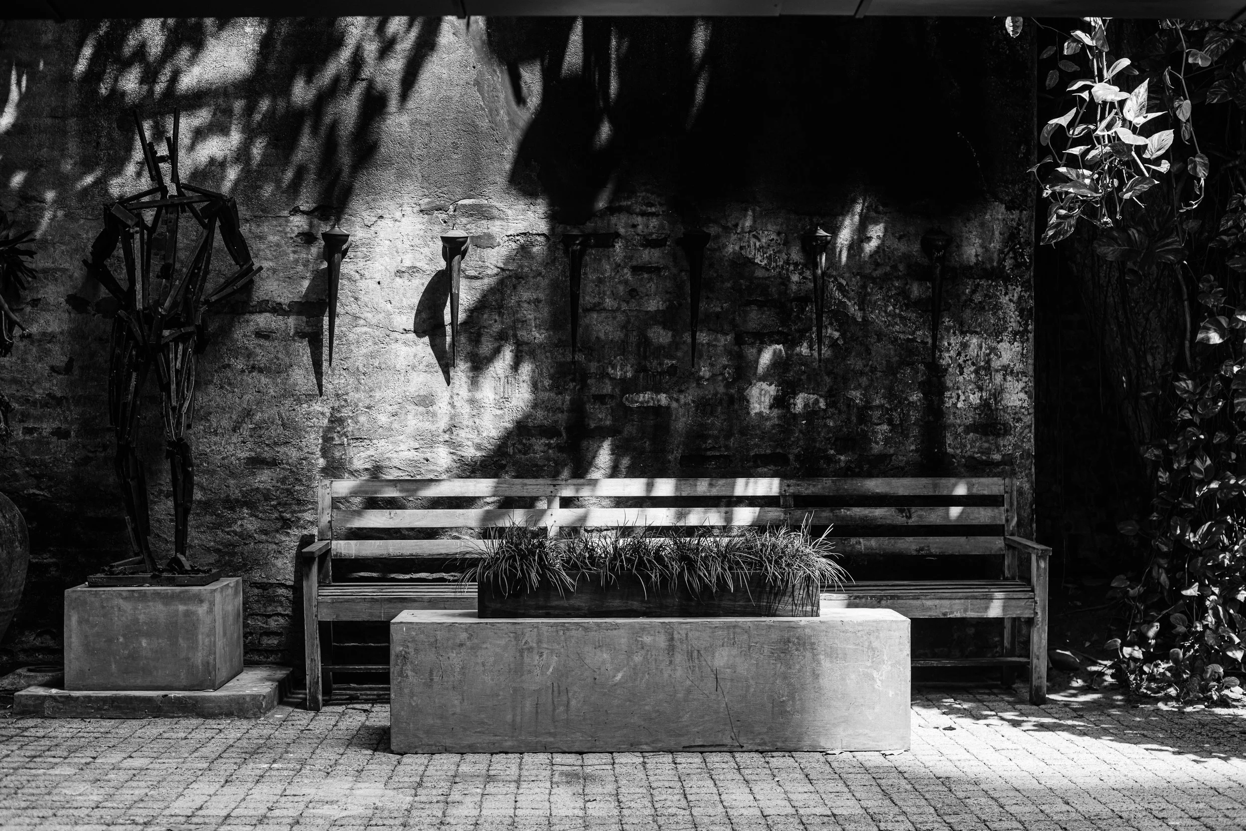 Black and white architectural photograph of courtyard seating at Gallery Café, Paradise Road, Colombo