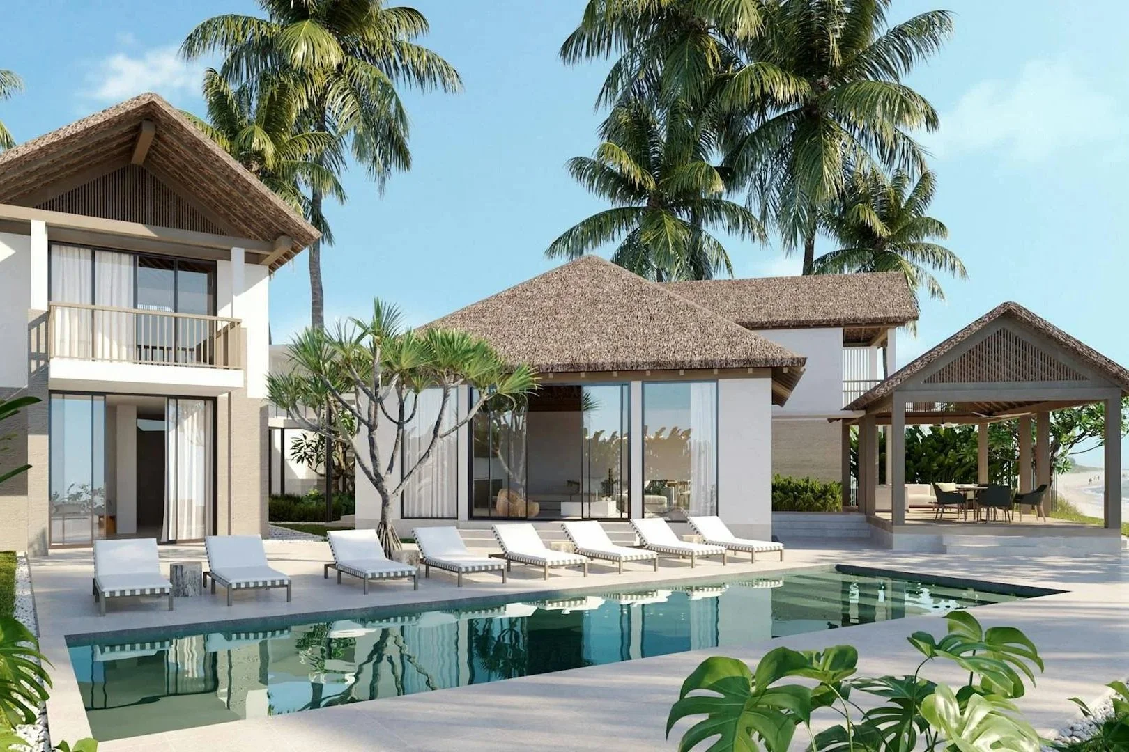 A modern tropical villa with an outdoor swimming pool, surrounded by palm trees, lounge chairs, and a shaded outdoor dining area.