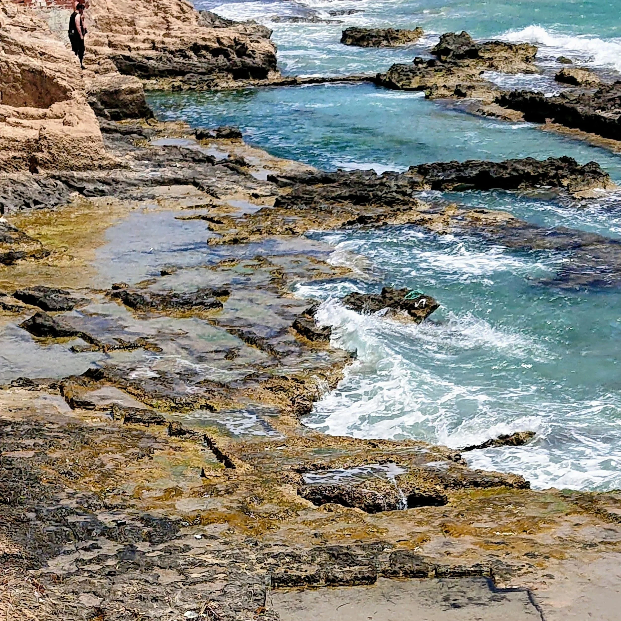 A tranquil coastal scene capturing rugged rock formations and turquoise water. Photographed by Daines Royal Limited, this image highlights the agency’s eye for natural landscapes, ideal for travel, tourism, and environmental marketing campaigns with 
