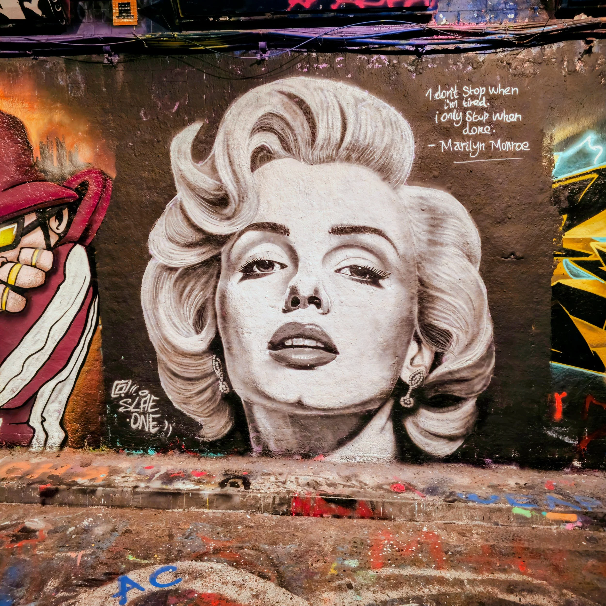 Monochrome graffiti portrait mural of an iconic figure, highlighting artistic expression and street culture. Captured by Daines Royal Limited, this striking urban artwork exemplifies the agency’s commitment to bold marketing visuals and professional 