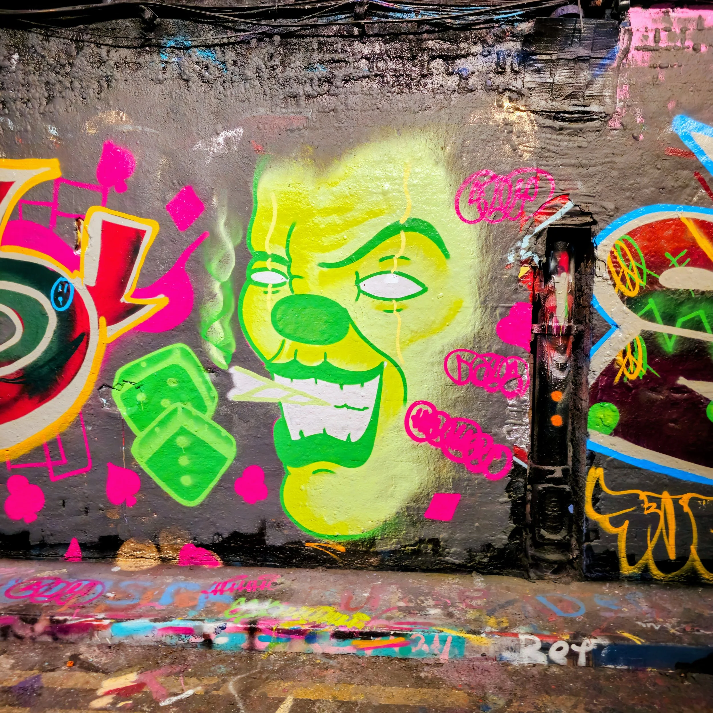 Vibrant urban graffiti artwork featuring a neon green cartoon-style character with bold street art detail, captured by Daines Royal Limited. Perfectly reflecting creative energy and expressive design, this visual represents the agency’s focus on loca