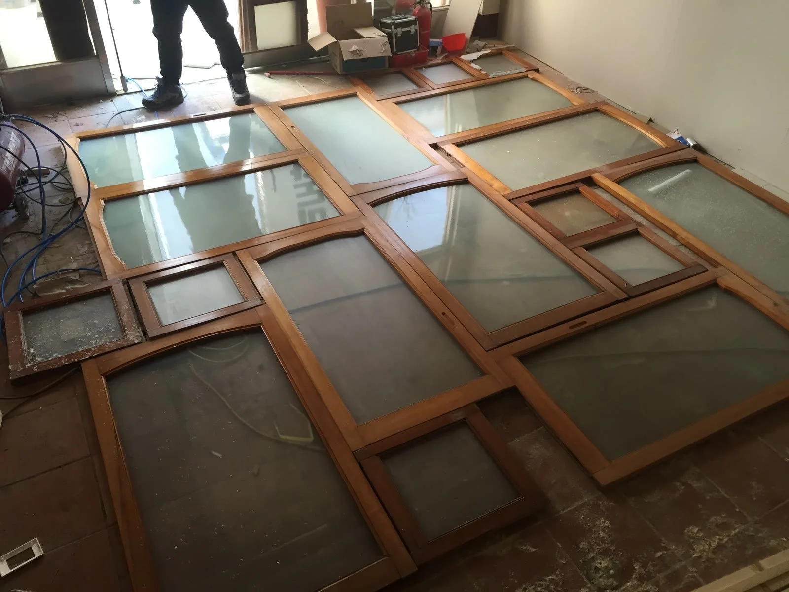 Old windows gathered and assembled on the floor