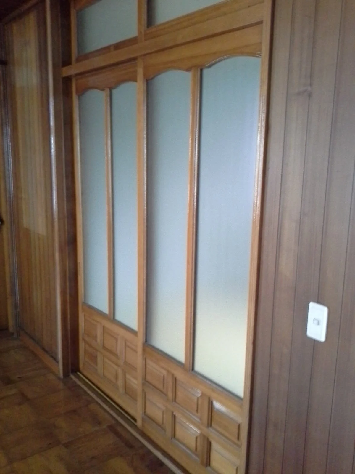 Original wooden sliding doors with frosted glass